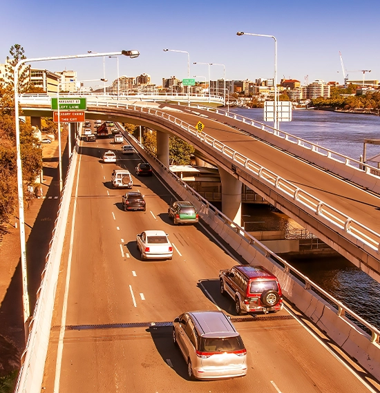 City traffic along Brisbane River on a major city road, Australia