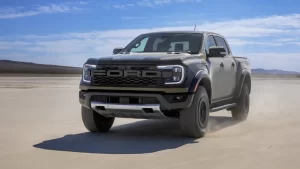 New Ford Ranger Raptor 2025 driving along beach